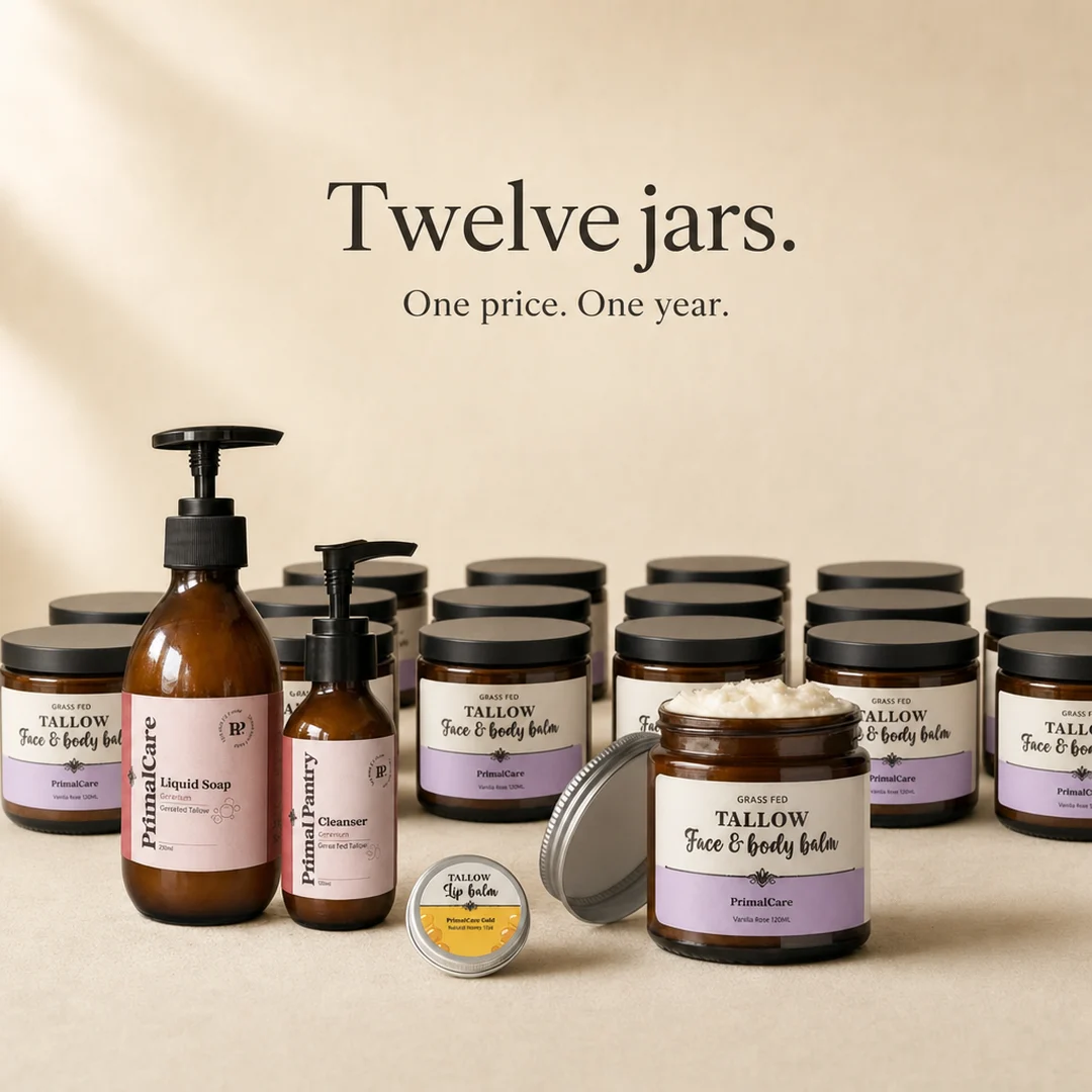 Twelve jars of Whipped Tallow Balm with the cleanser, liquid soap and lip balm in front